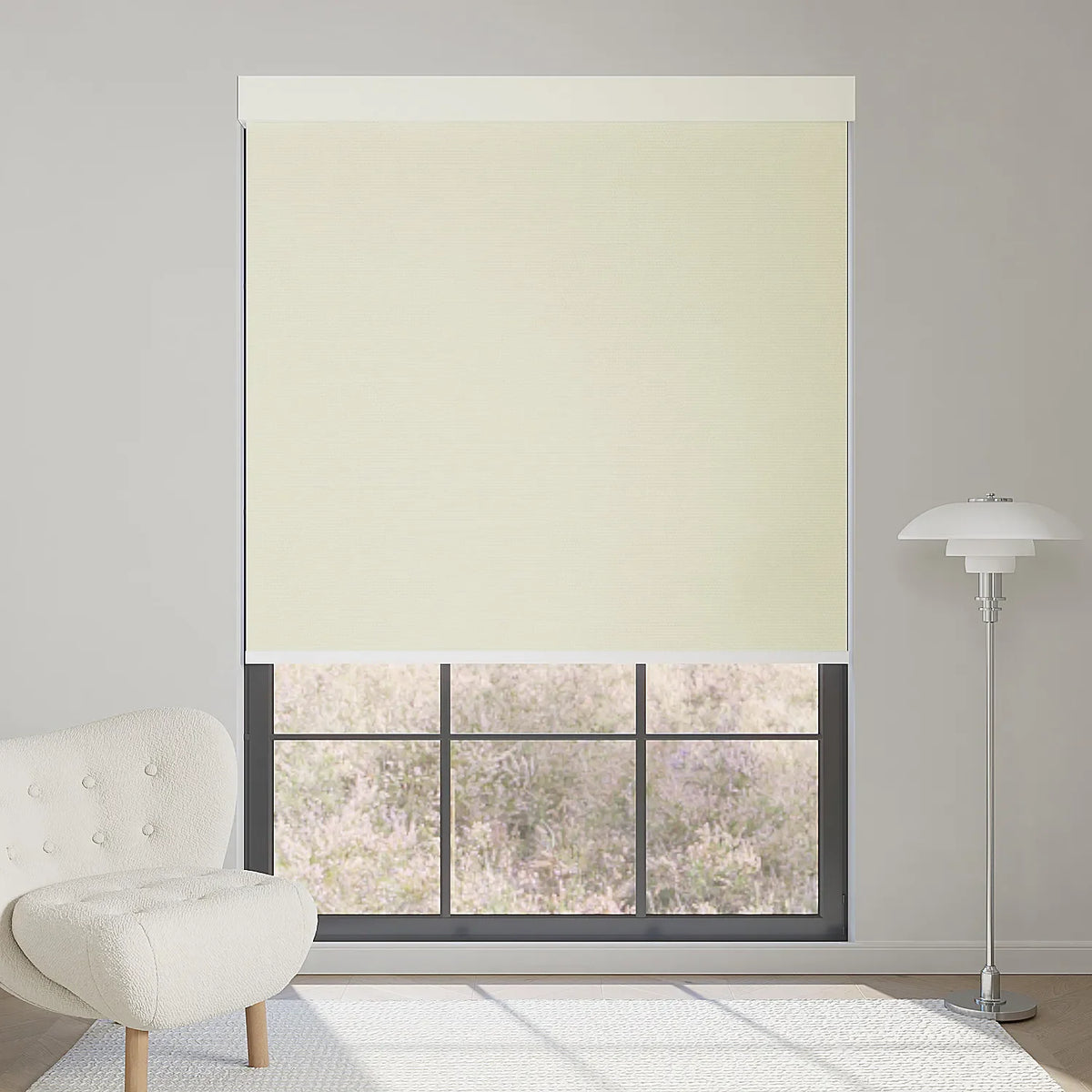 Half-height electric roller shade in cream blocks sunlight, ideal for bedrooms or workspaces.
