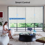Female homeowner reading at home, using Alexa voice control to adjust beige light-filtering motorized roller shades.