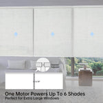 Close-up of panel gap in beige motorized coupled roller shades, highlighting seamless installation for large windows.