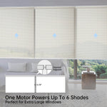 Close-up of panel gap in beige solar motorized coupled roller shades, ensuring seamless installation for large windows.
