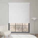 Jacquard white motorized blackout roller shade with elegant textured pattern, softening sunlight while brightening and refining interiors.