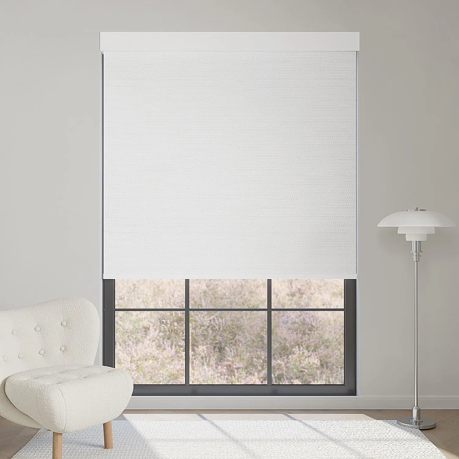Jacquard white motorized blackout roller shade with elegant textured pattern, softening sunlight while brightening and refining interiors.