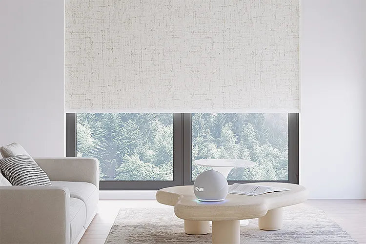 Motorized blackout roller shade with vinyl fabric installed in a bright modern living room