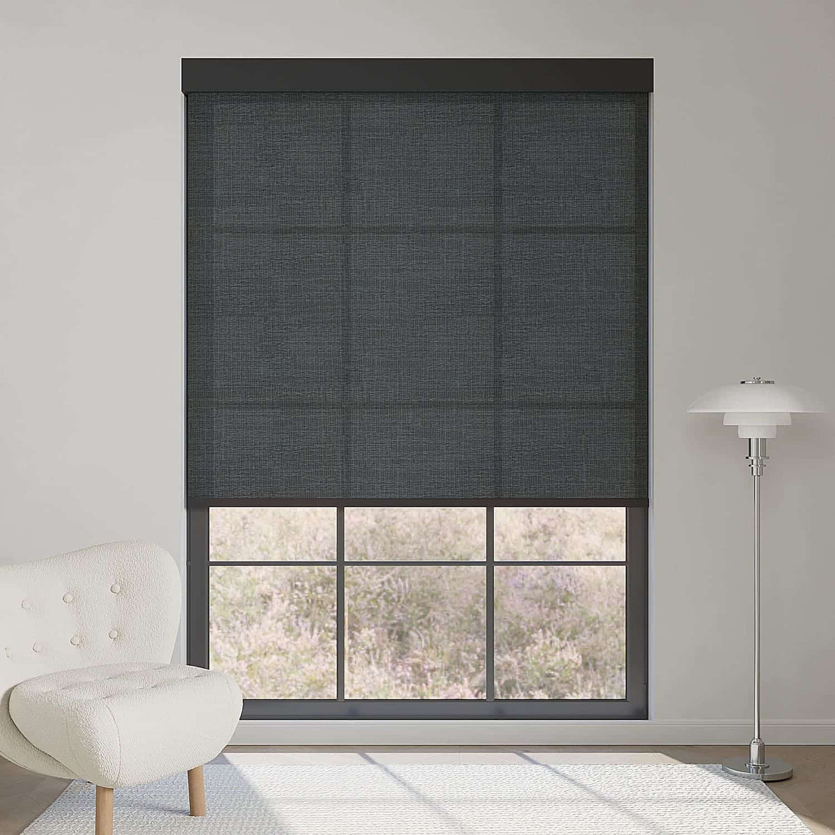 Minimalist fabric black light filtering roller shade softens sunlight while adding sleek, contemporary contrast to modern interiors.