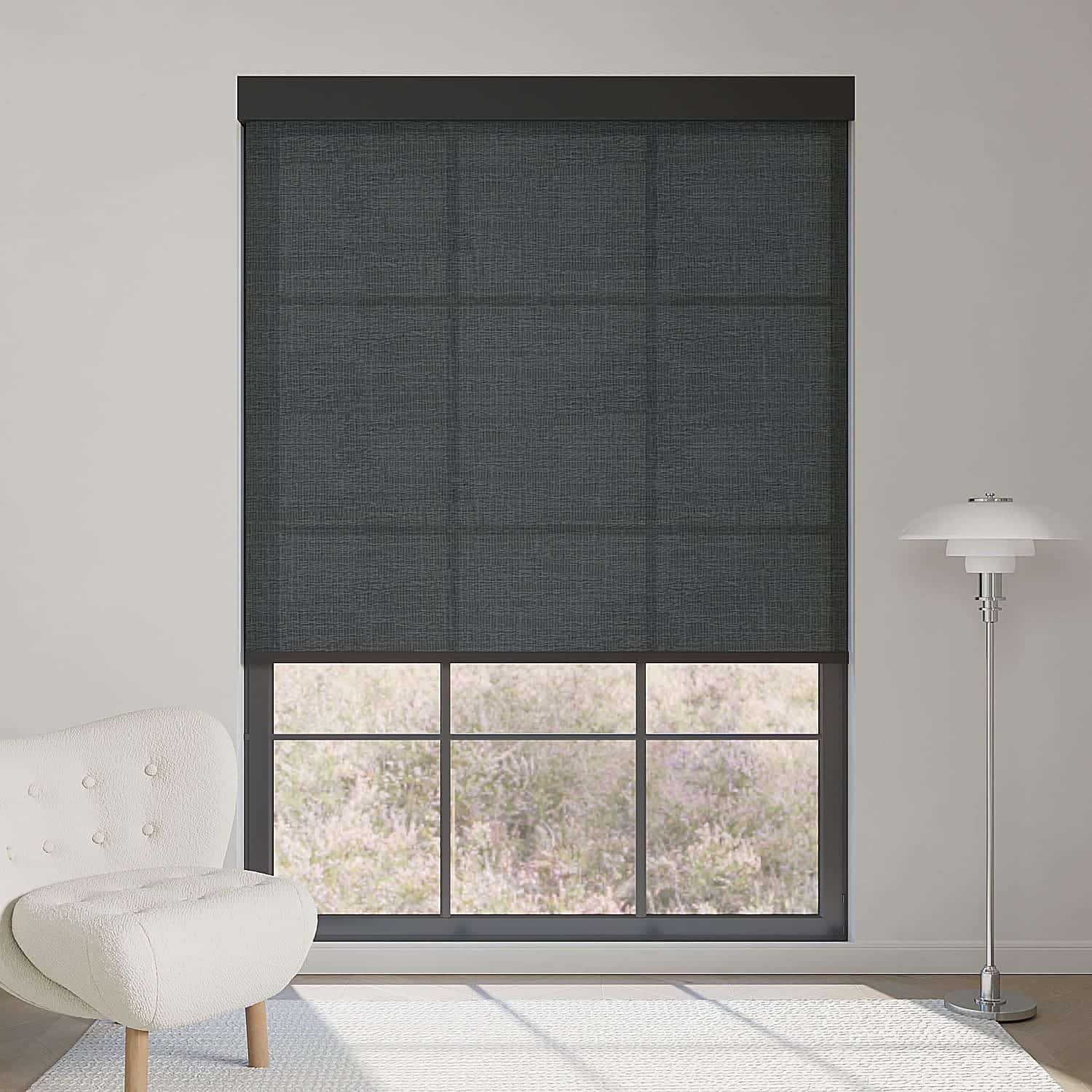 Minimalist fabric black light filtering roller shade softens sunlight while adding sleek, contemporary contrast to modern interiors.