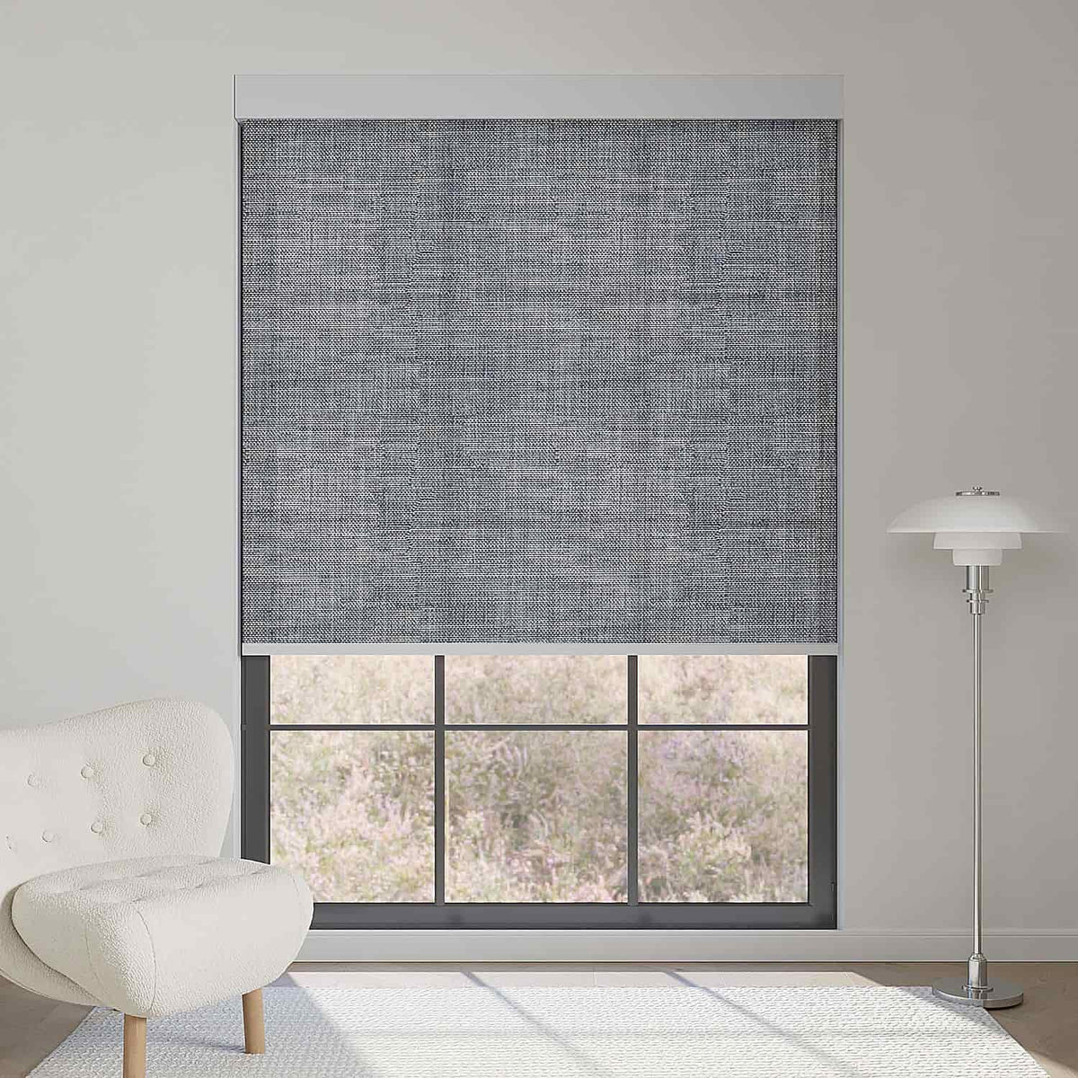 Fabric smoky gray textured light filtering roller shade softens sunlight while adding modern, refined textured depth to interiors.