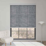 Fabric smoky gray textured light filtering roller shade softens sunlight while adding modern, refined textured depth to interiors.