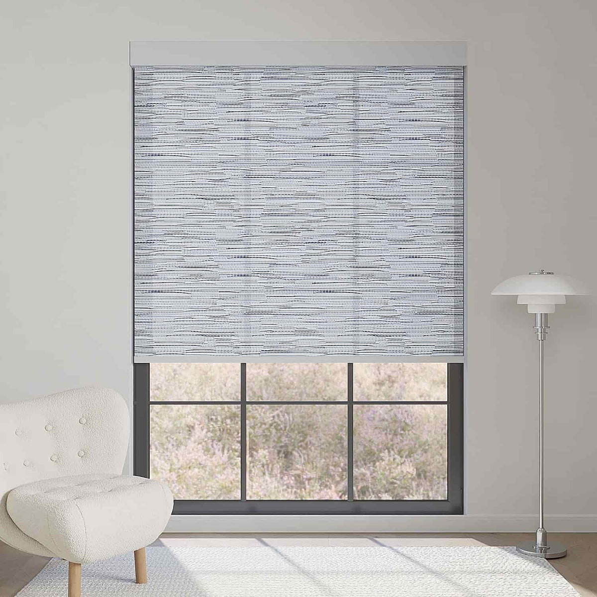 Jacquard grey light filtering roller shade softens sunlight while bringing refined, modern textured elegance to rooms.