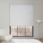 Light gray 1% openness solar shade reduces harsh sunlight, provides privacy, and delivers soft indoor brightness.