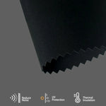 Black fabric blackout roller shade reduces heat, dampens noise, and stabilizes indoor temperature for energy-efficient comfort.