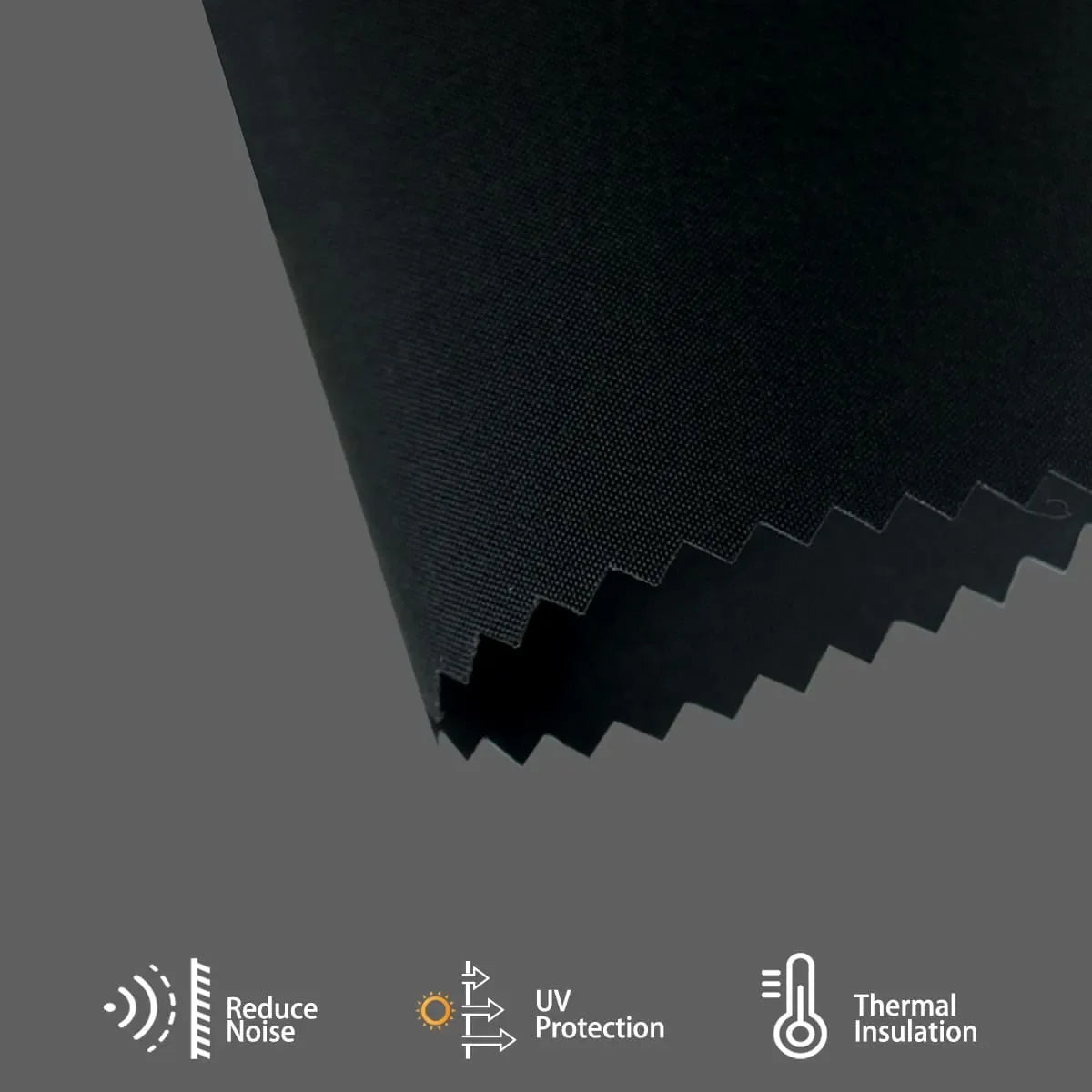 Black fabric blackout roller shade reduces heat, dampens noise, and stabilizes indoor temperature for energy-efficient comfort.