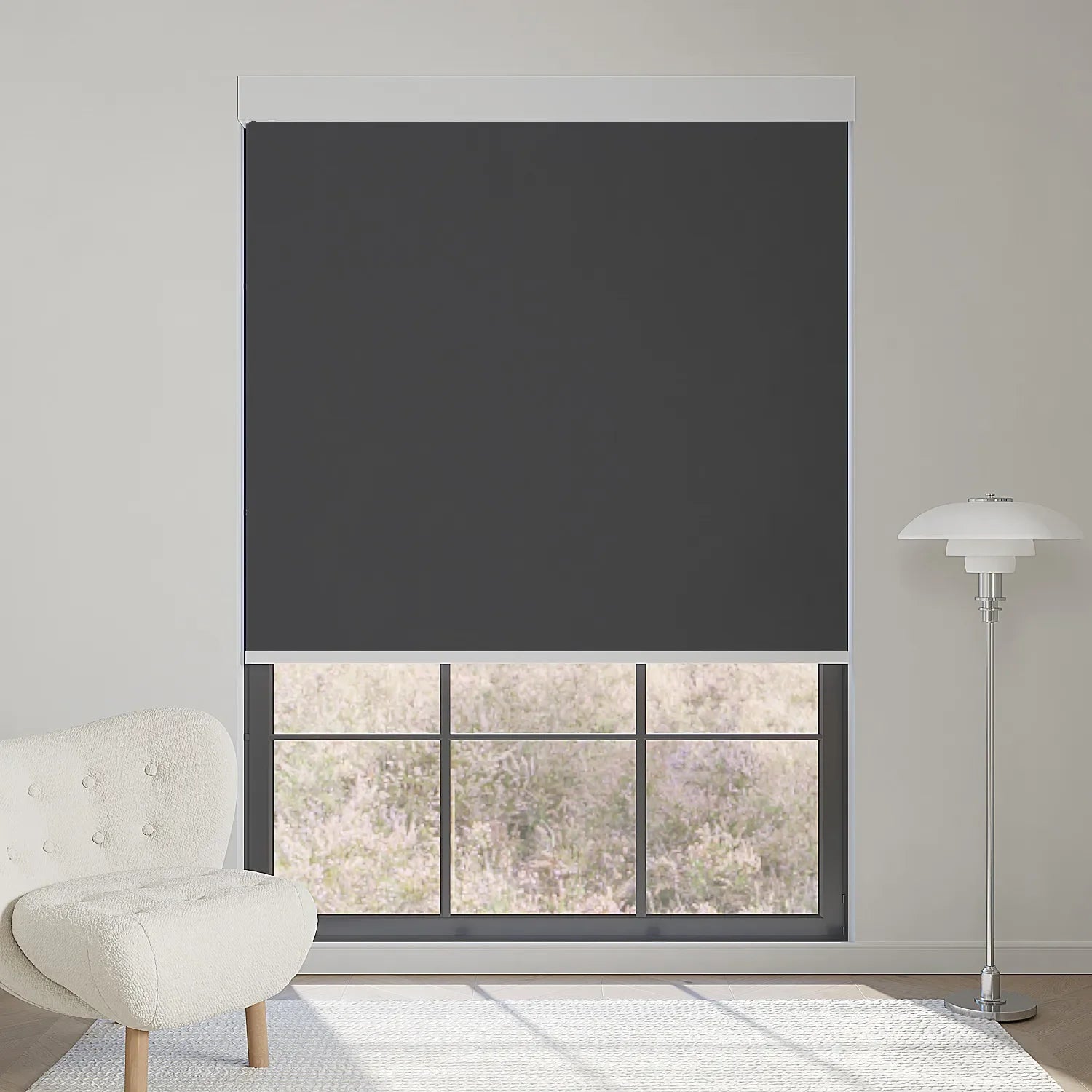 Dark grey motorized blackout roller shade in fabric series, blocks sunlight while keeping a clear lavender garden view.
