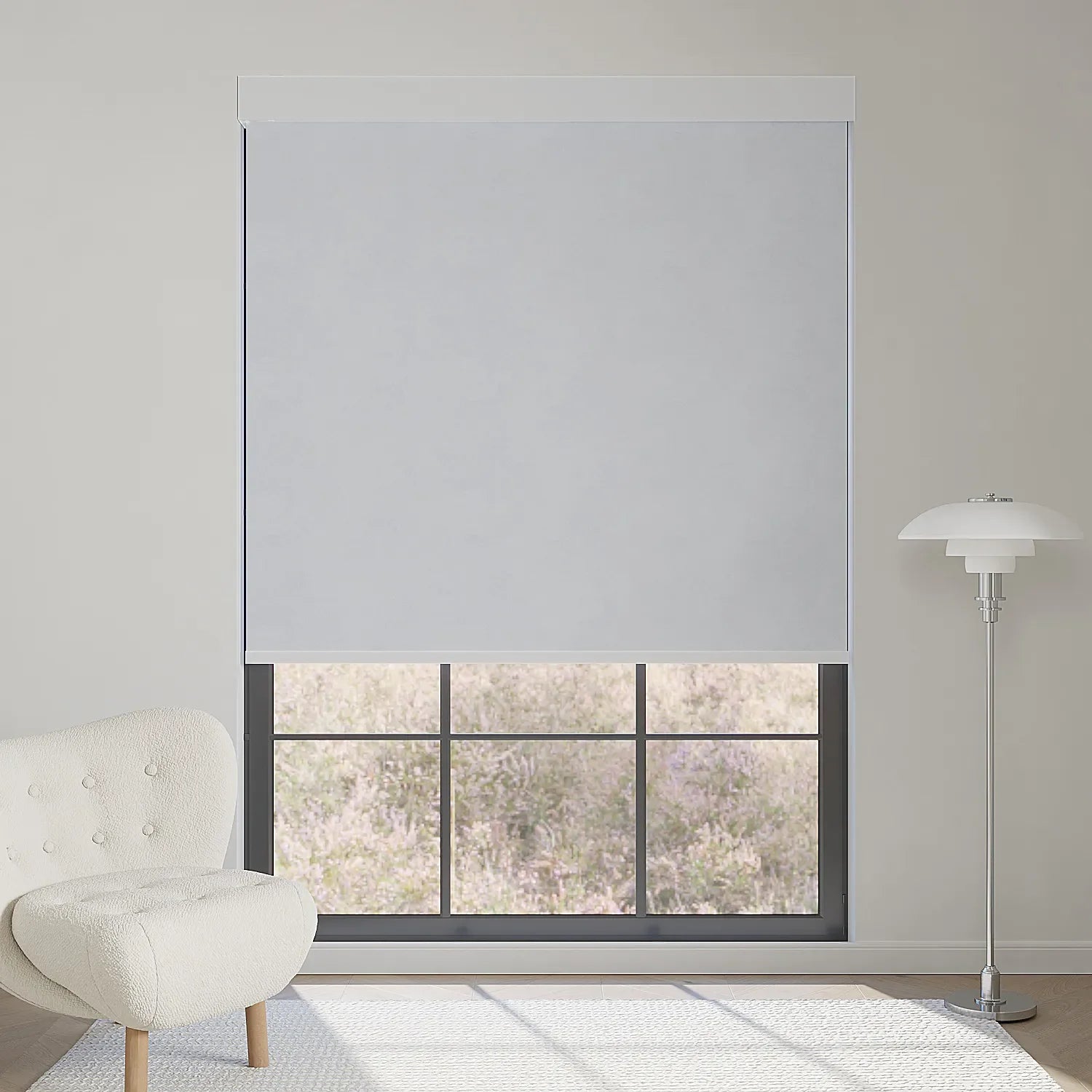 Light grey motorized blackout shade gently filters sunlight, keeping the lavender garden view while creating a calm interior.