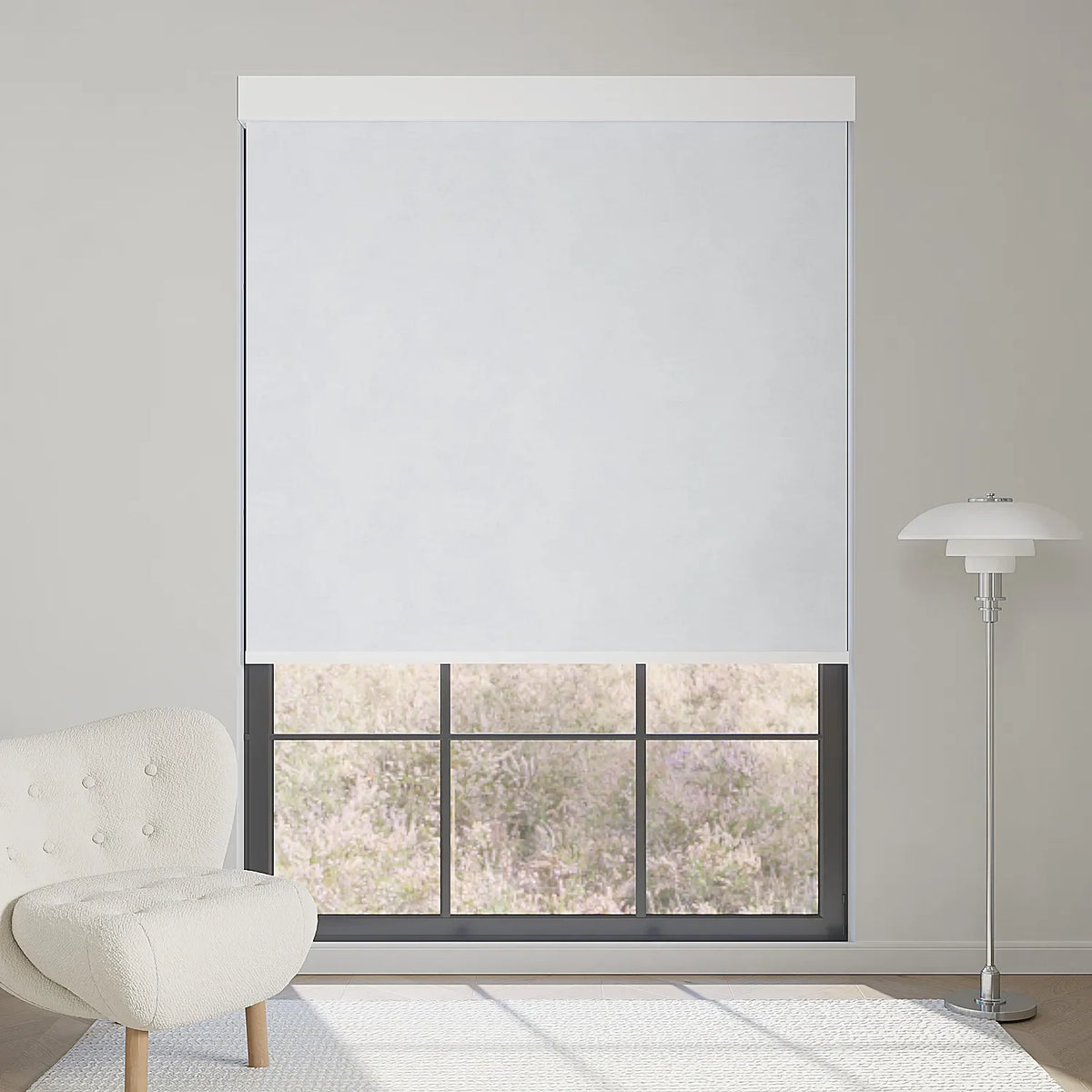 White motorized blackout roller shade in fabric series, blocks glare yet brightens the room while keeping the lavender view outside.