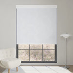 White motorized blackout roller shade in fabric series, blocks glare yet brightens the room while keeping the lavender view outside.
