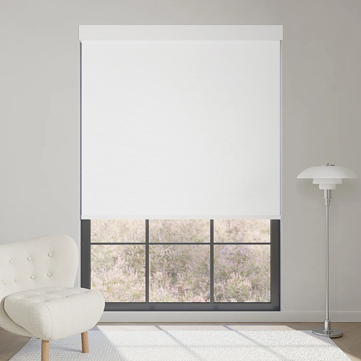 Elegant pure white motorized blackout roller shade, softening sunlight while enhancing a bright, luxurious modern interior.
