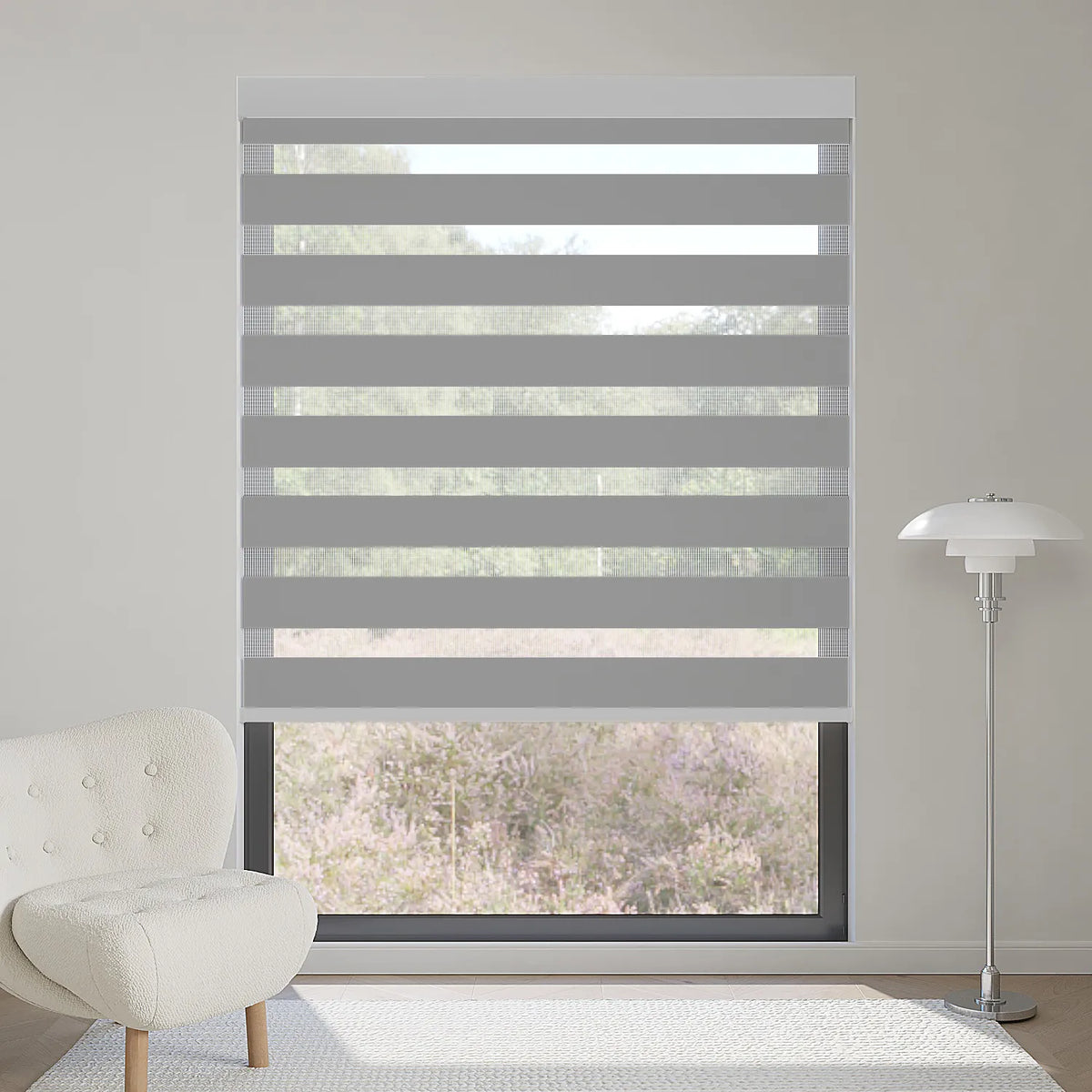 Classic 75% dark grey zebra shade partially blocks sunlight, adding a sophisticated layered effect to interiors.