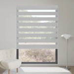 Classic 65% light grey motorized zebra shade filters sunlight while providing subtle, modern layered lighting indoors.